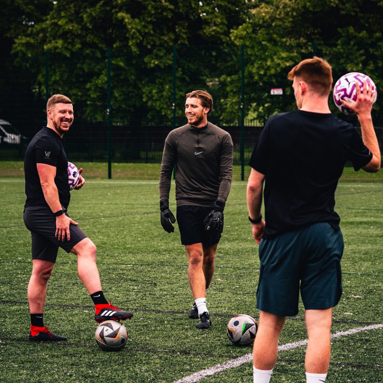 3 men laughing during football training