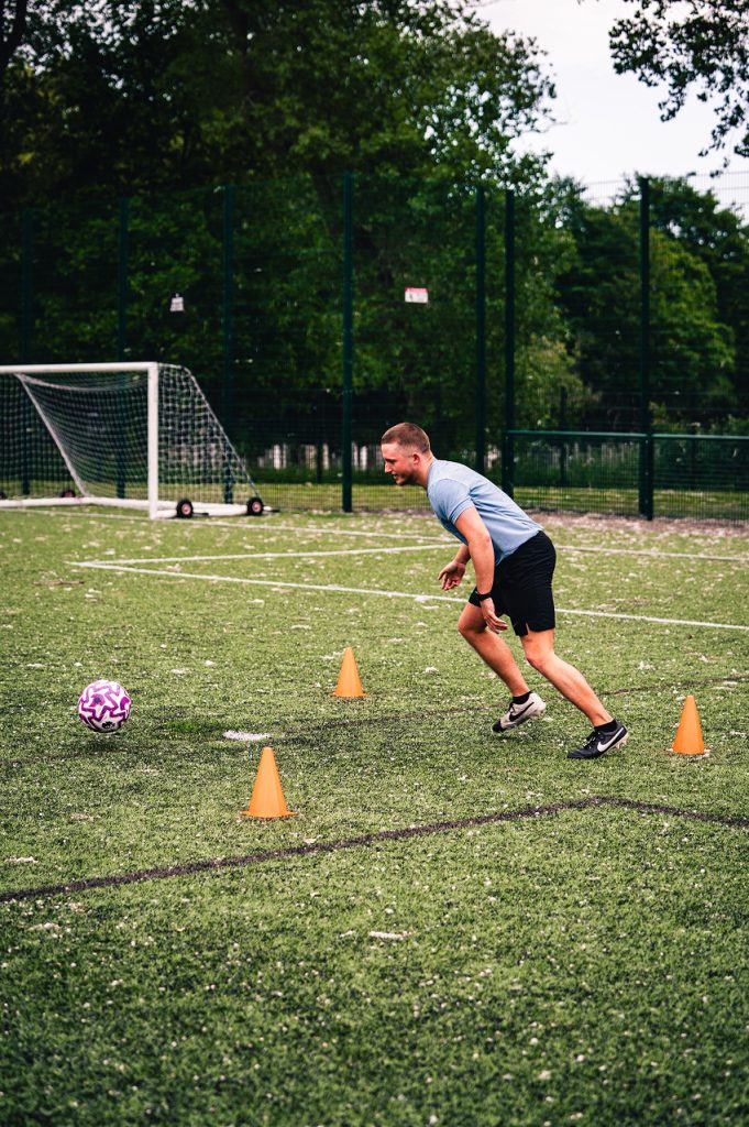 Kyzen Tax Senior Nathan Byrne running after a football