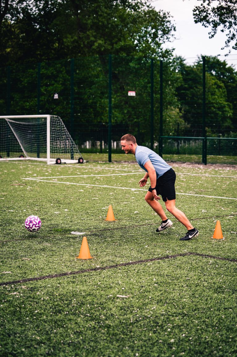 Kyzen Tax Senior Nathan Byrne running after a football